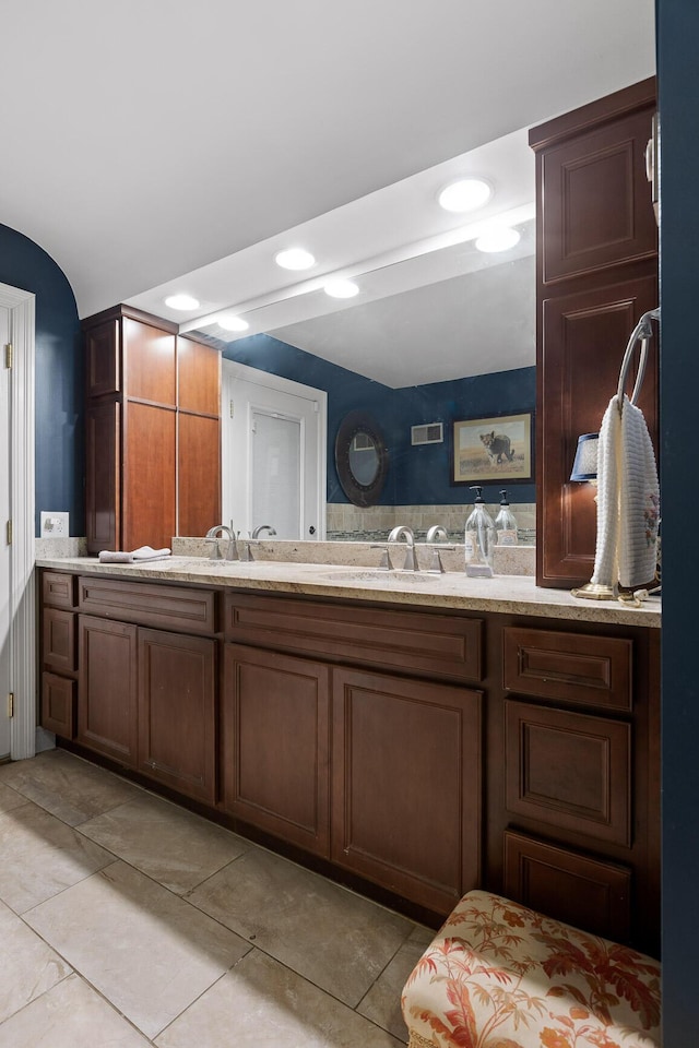 bathroom with vanity and tile patterned floors