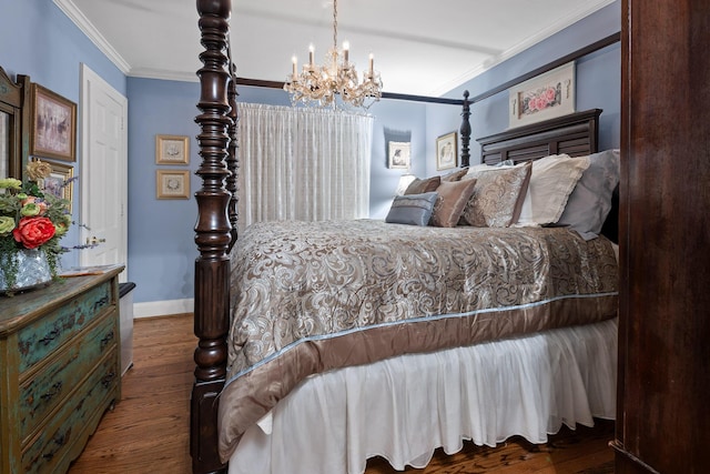 bedroom with hardwood / wood-style flooring, a chandelier, and crown molding