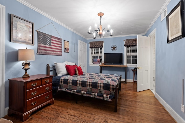 bedroom featuring crown molding, hardwood / wood-style floors, and a chandelier