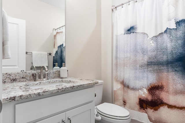 bathroom with toilet, a shower with shower curtain, and vanity