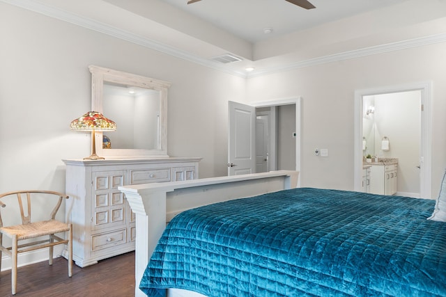 bedroom featuring ceiling fan, dark hardwood / wood-style floors, ensuite bathroom, and crown molding