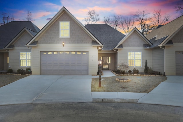 craftsman house with a garage