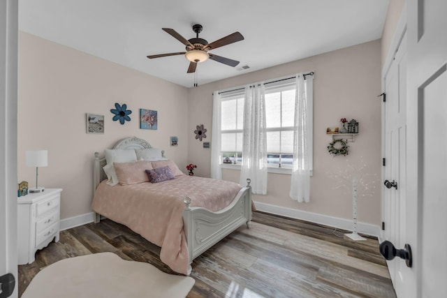 bedroom featuring light hardwood / wood-style flooring and ceiling fan