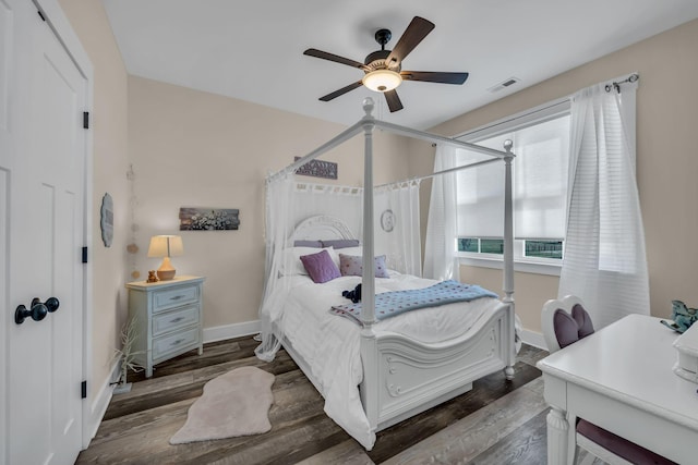 bedroom featuring dark hardwood / wood-style floors and ceiling fan