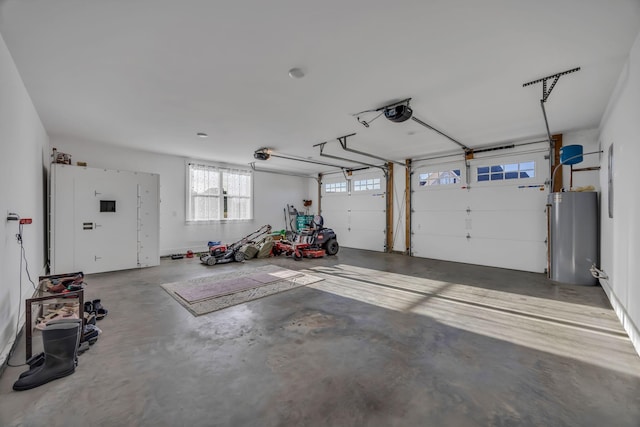 garage with water heater and a garage door opener