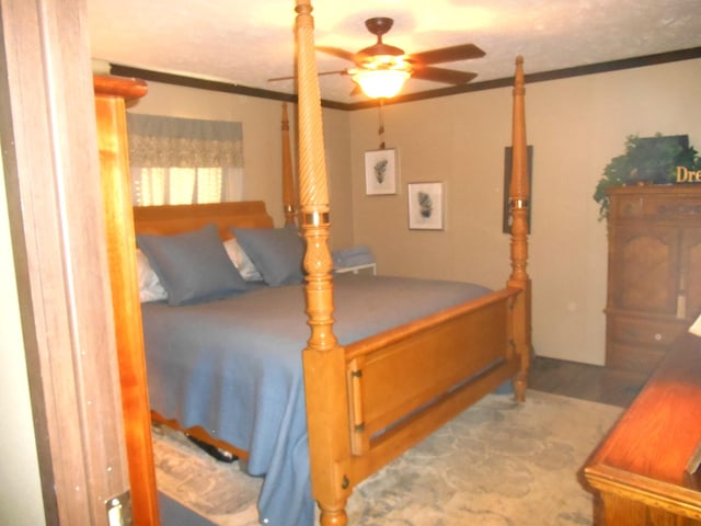 bedroom with crown molding and ceiling fan