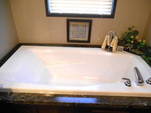 interior details featuring tiled bath