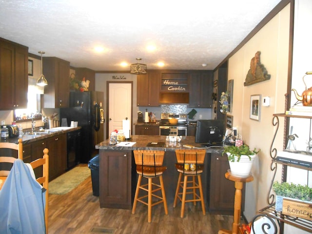 kitchen featuring dishwasher, sink, electric range, kitchen peninsula, and dark wood-type flooring