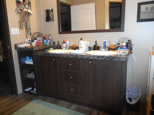 bathroom with vanity and hardwood / wood-style floors