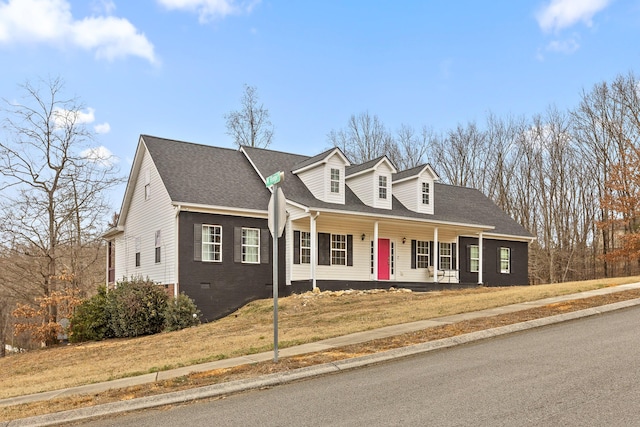 cape cod home featuring a front lawn and a porch