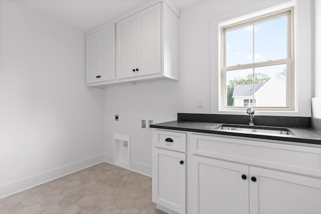 laundry room with cabinets, electric dryer hookup, sink, and a wealth of natural light