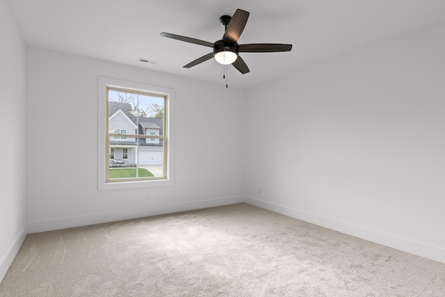 carpeted empty room with ceiling fan