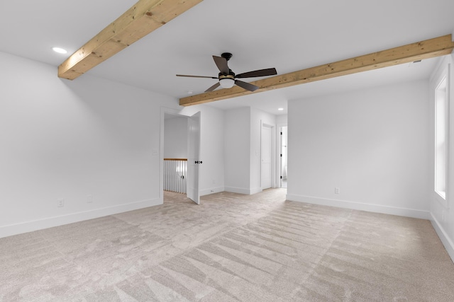 interior space featuring beamed ceiling, light carpet, and ceiling fan