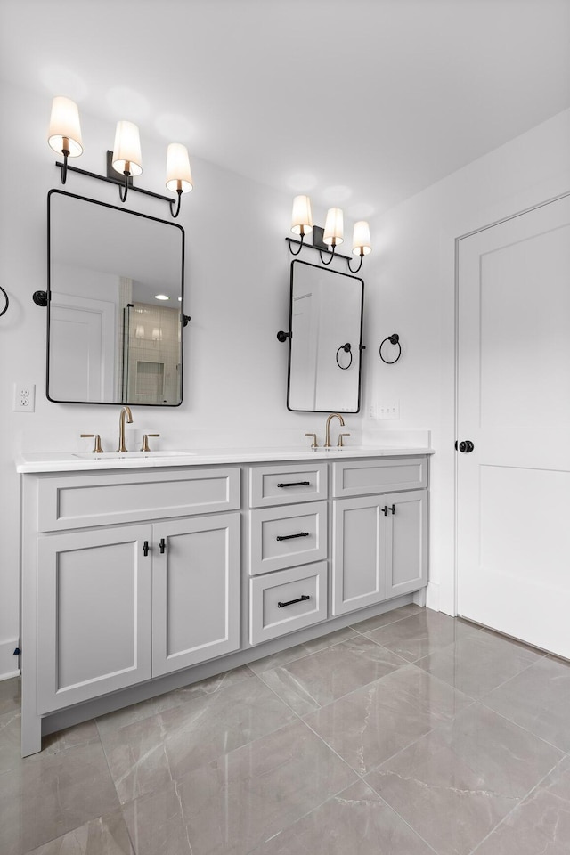 bathroom featuring vanity and a shower with door