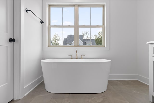 bathroom featuring a tub to relax in