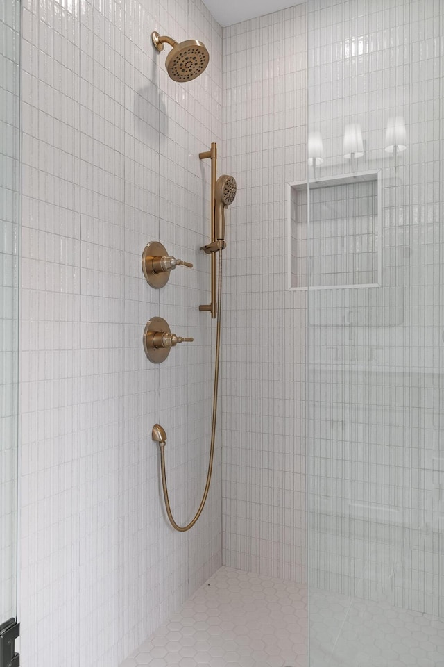 bathroom with a tile shower