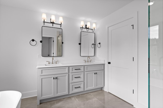 bathroom featuring vanity and a bath