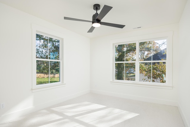 unfurnished room with carpet floors and ceiling fan