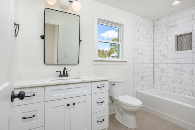 full bathroom with tile patterned floors, vanity, toilet, and tiled shower / bath