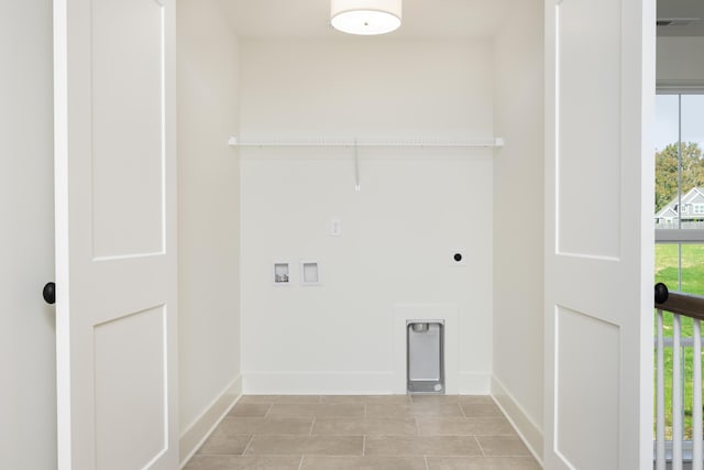 laundry area featuring hookup for a washing machine, a wealth of natural light, and hookup for an electric dryer