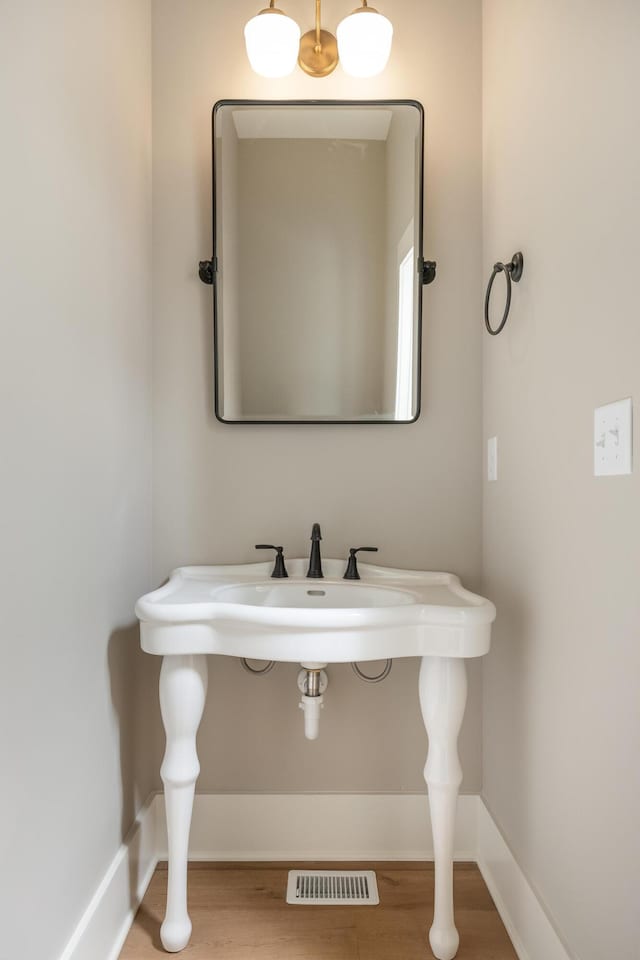 bathroom featuring sink and wood-type flooring