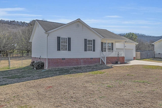 view of front of property with a garage and covered porch