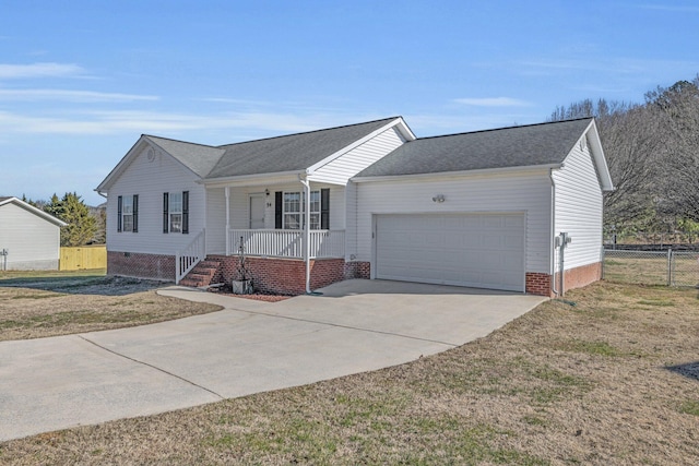 ranch-style house featuring a garage, a front lawn, and covered porch