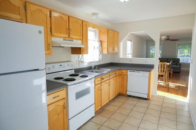 kitchen with sink, white appliances, light tile patterned floors, and ceiling fan