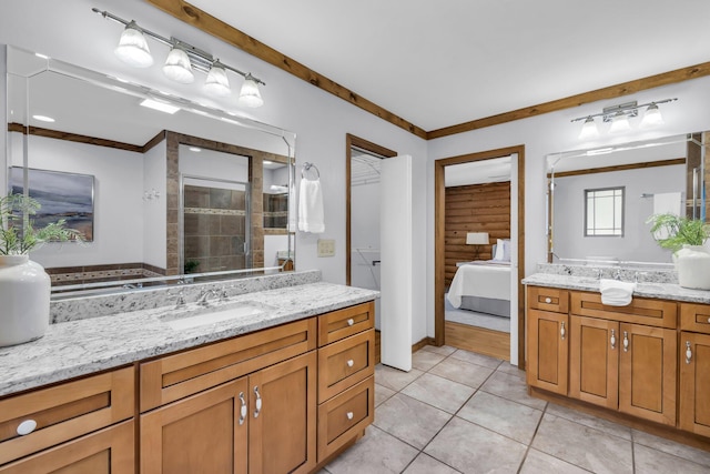 bathroom featuring vanity, tile patterned flooring, log walls, and walk in shower