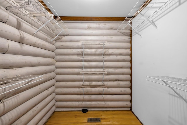 walk in closet featuring hardwood / wood-style floors