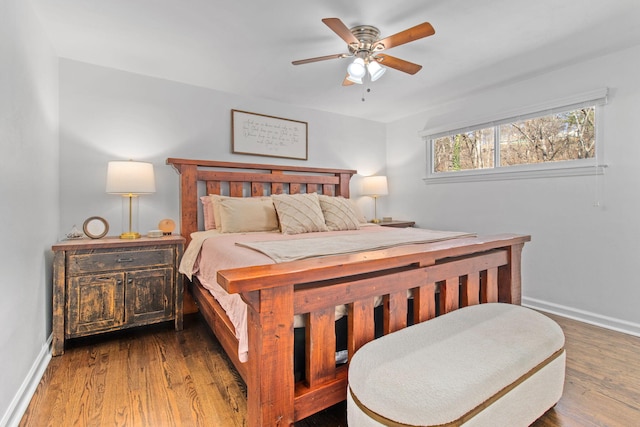 bedroom with hardwood / wood-style flooring and ceiling fan