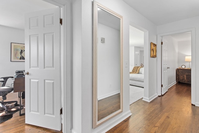 hallway featuring dark hardwood / wood-style flooring