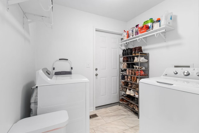 laundry area with independent washer and dryer