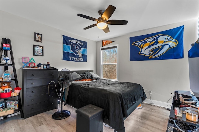 bedroom featuring wood-type flooring and ceiling fan