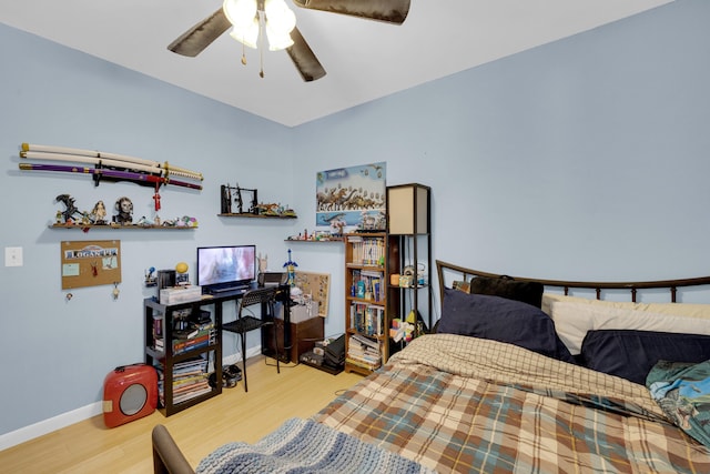 bedroom featuring hardwood / wood-style floors and ceiling fan