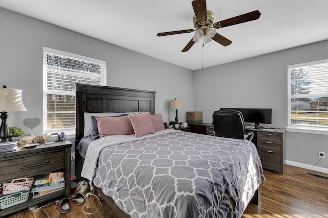 bedroom with ceiling fan and dark hardwood / wood-style floors