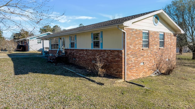 view of property exterior with a lawn