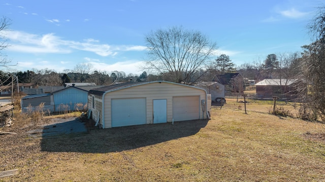 garage with a yard