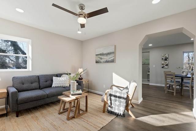 living room with hardwood / wood-style floors and ceiling fan