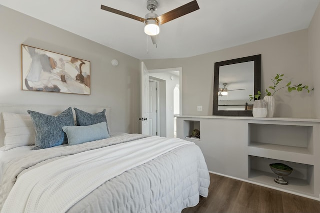 bedroom featuring dark hardwood / wood-style floors and ceiling fan