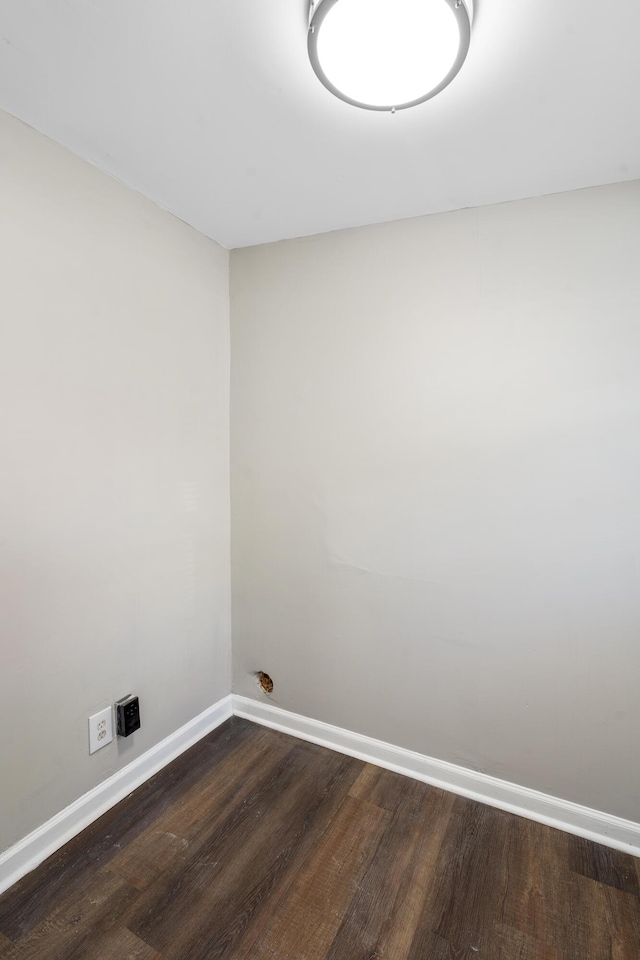 empty room with dark hardwood / wood-style floors