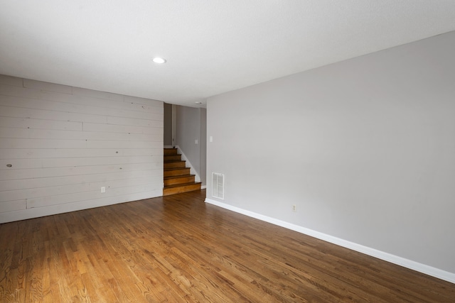 spare room with hardwood / wood-style floors