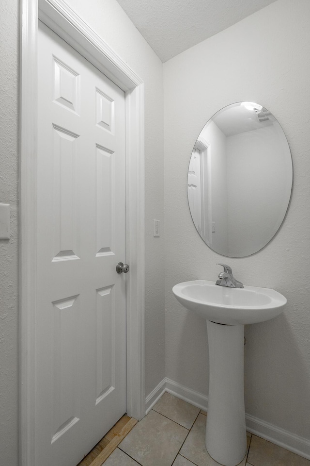 bathroom featuring tile patterned flooring