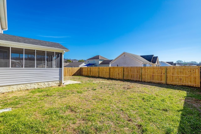 view of yard featuring a sunroom