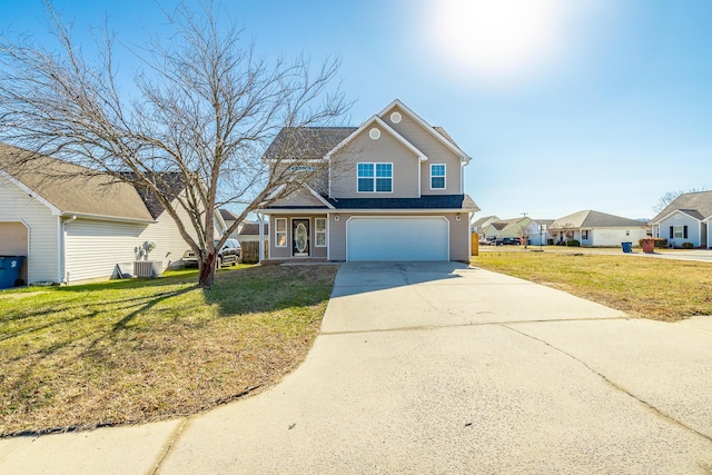 view of front of home featuring a garage, central AC unit, and a front yard