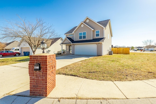 view of front of home featuring a garage, a front yard, and central air condition unit