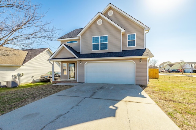 view of front of property with a garage, a front yard, and central air condition unit