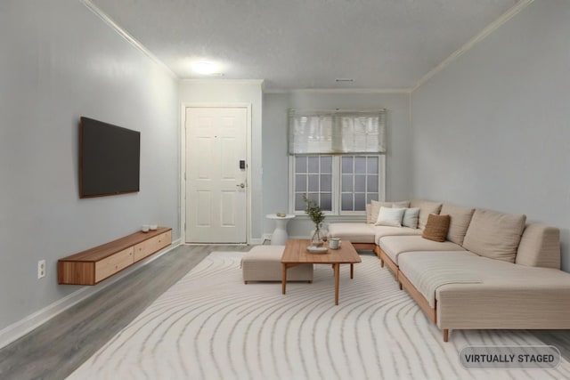 living room with hardwood / wood-style flooring and crown molding