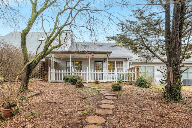 ranch-style home featuring central AC unit