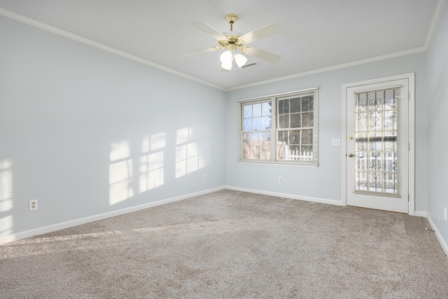 carpeted empty room featuring ornamental molding, a textured ceiling, and ceiling fan